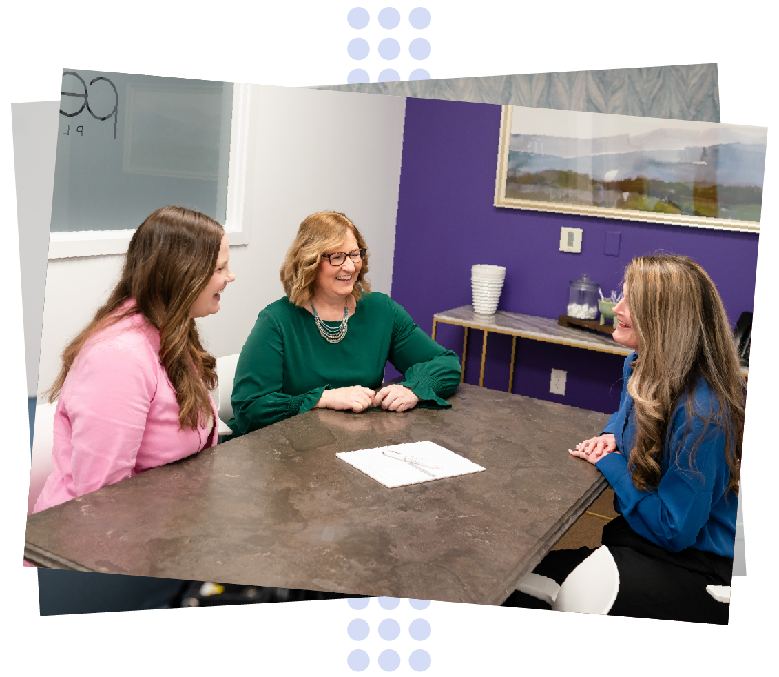 financial planner meeting with happy smiling clients